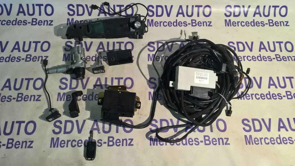 ORYGINALNY CENTRALNY ZAMEK NA PILOTA MERCEDES 124